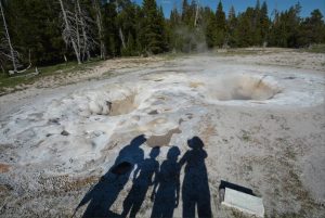 Silhouettes of a family on Upper Geyser Basin in Yellowstone National Park