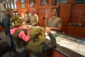 Two Junior Rangers being sworn in by a NPS Ranger