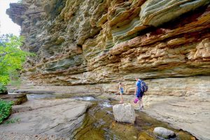 A family hikes near Devils Bathtub in the Black Hills of South Dakota
